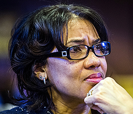 Flint Mayor Karen Weaver listens as Genesee County board Chairman Jamie Curtis speaks Monday, Jan. 4, 2016, in Flint, Mich. Curtis, supported by the board, declared a state of emergency Monday as plans move forward to seek more help handling problems with Flint's water system. (Jake May/The Flint Journal-MLive.com via AP)