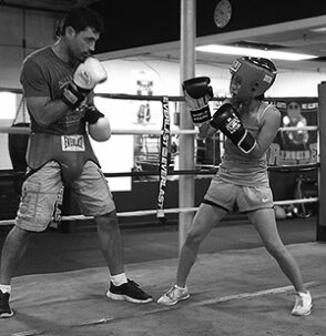 Mia sparring with her boxing coach, Marc Gargaro of Nonantum Boxing Club 