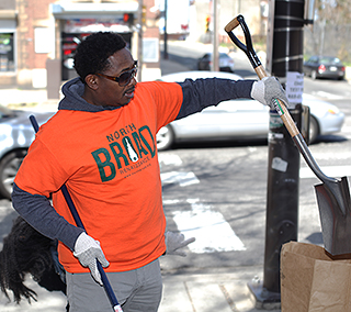 Robert Philips from Vision of Hope Baptist Church assist in the North Broad Clean Up during the 9th Annual Philly Spring Clean Up